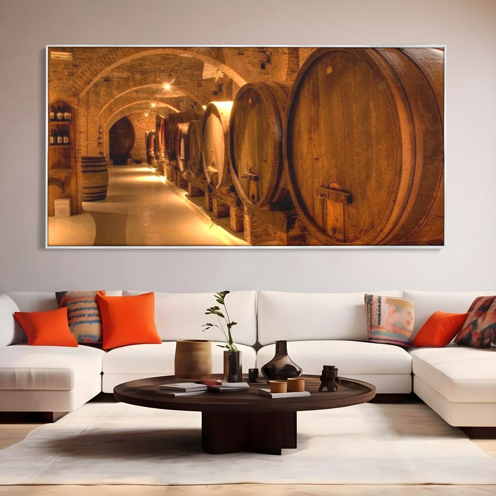 Tablou canvas cu tablou canvas cu butoaie de vin in crama, in rama de aluminiu argintiu, pe perete intr-un living